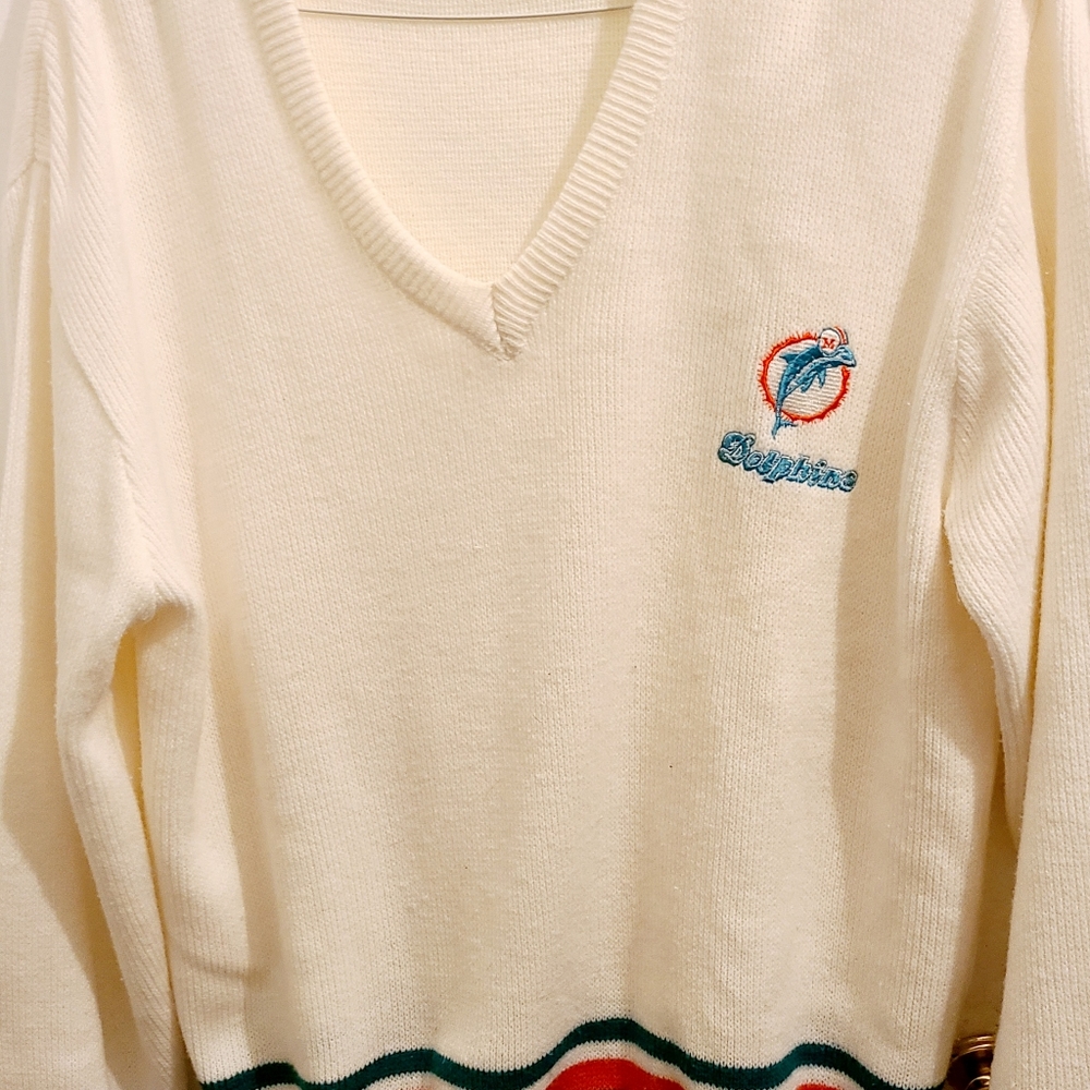DOLPHINS SWEATER SIZE LCOLOR WHITE WITH BLUE AND ORANGE INEXCELLENT CONDITION